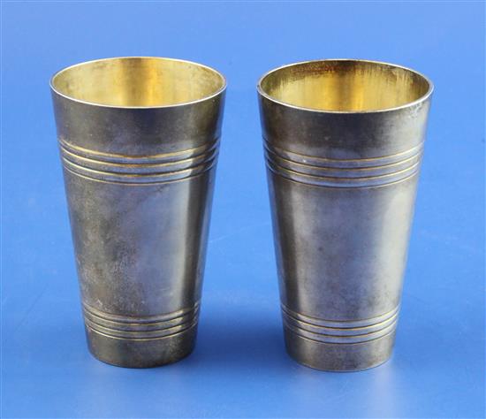 A pair of late 19th century Russian 84 zolotnik silver tumblers, 3.5in.